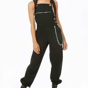 NWT Black overalls with side silver chain.